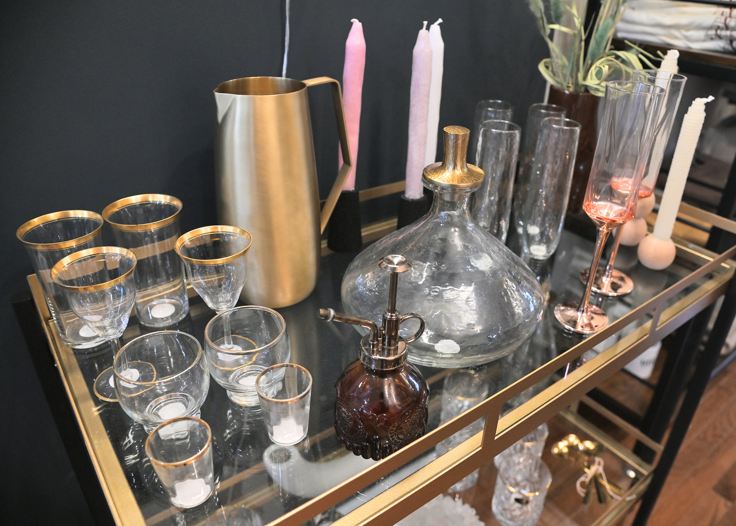 A bar cart, glassware, and more on display at Abode.