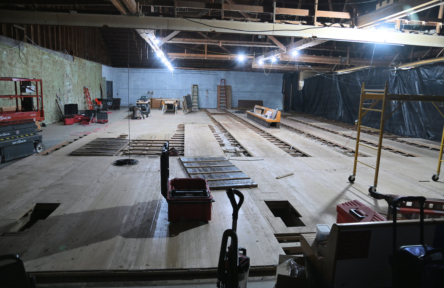 Behind the plastic, work continues on the removal of the lanes at King Pin Lanes to make way for a new arcade.
