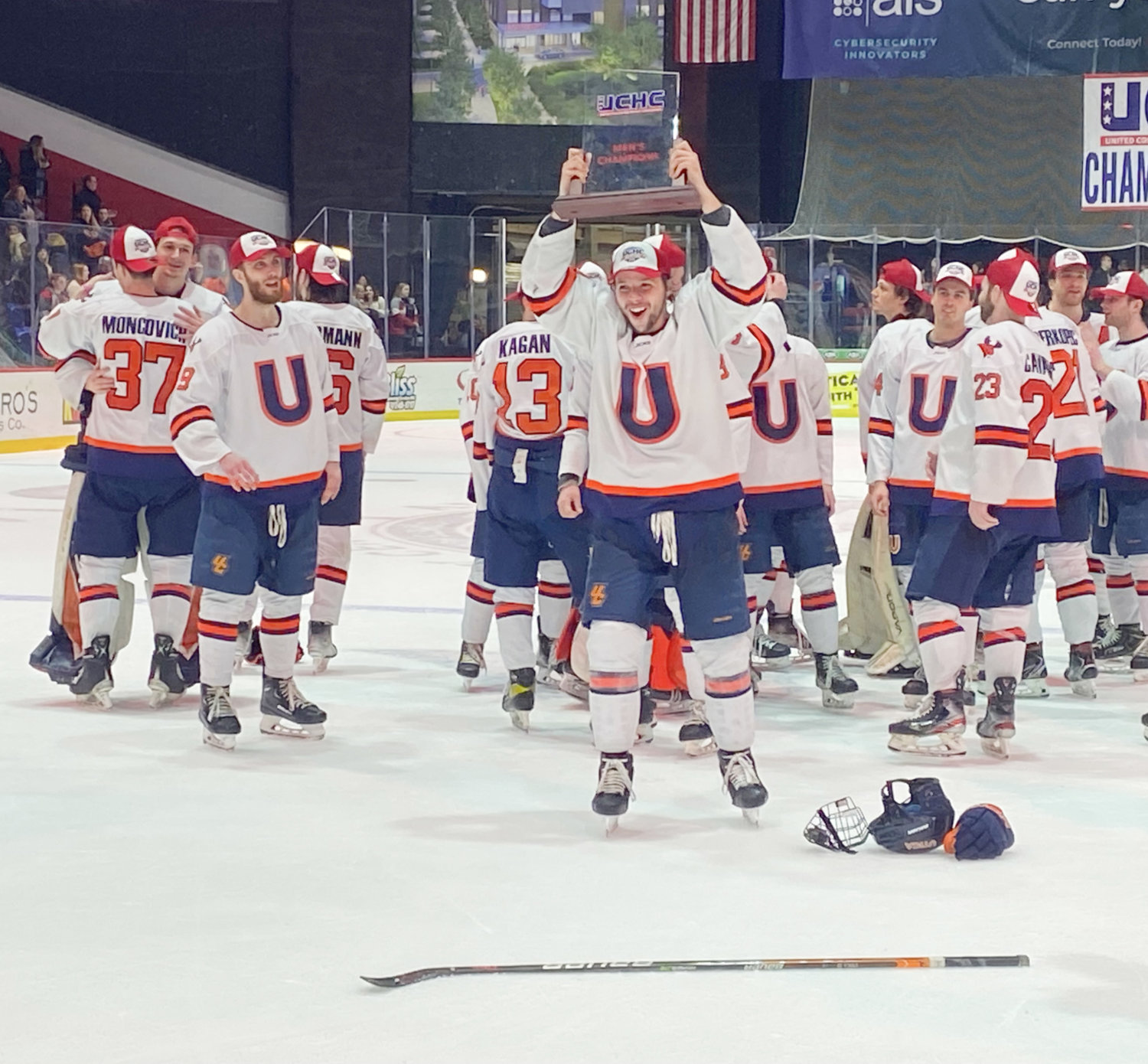 The Utica University men's hockey team celebrates with the United Collegiate Hockey Conference  trophy after topping Nazareth 5-3 in the conference final on Saturday in Utica. It is the second time in as many seasons Utica has won the conference title.