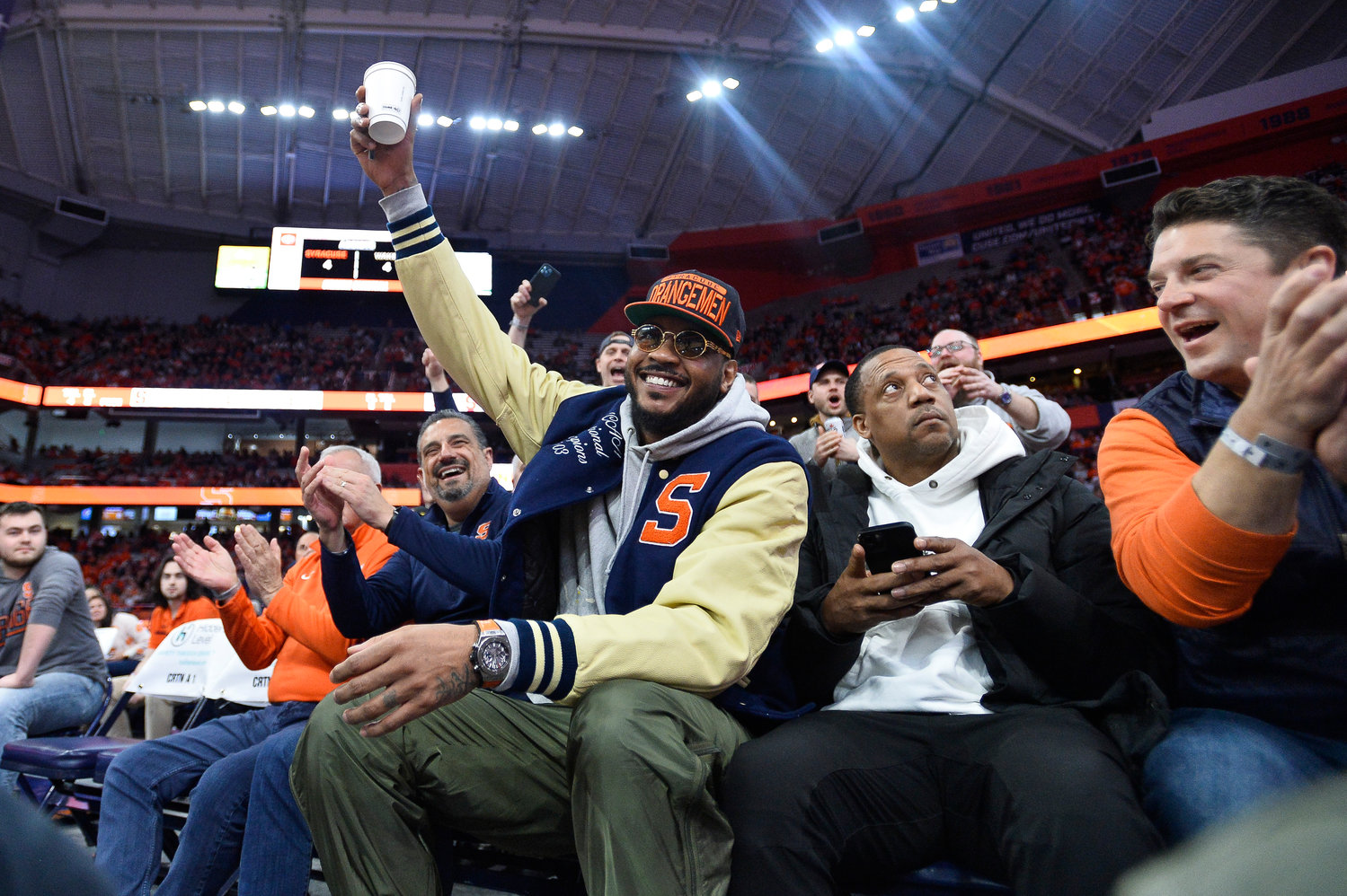 Carmelo Anthony waves to the crowd during the first half of Saturday's game between Syracuse and Wake Forest. Anthony and the 2003 national champion team was recognized at halftime.
