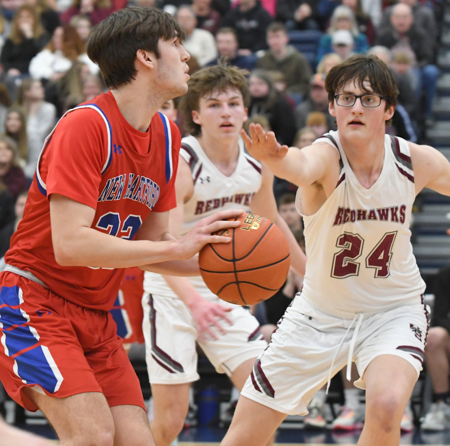 New Hartford's Colton Suriano squares up for a shot with Central Square's Cameron Pownall defending in the first half Sunday night at SRC Arena. New Hartford won 65-60 to earn the Section III Class A title.