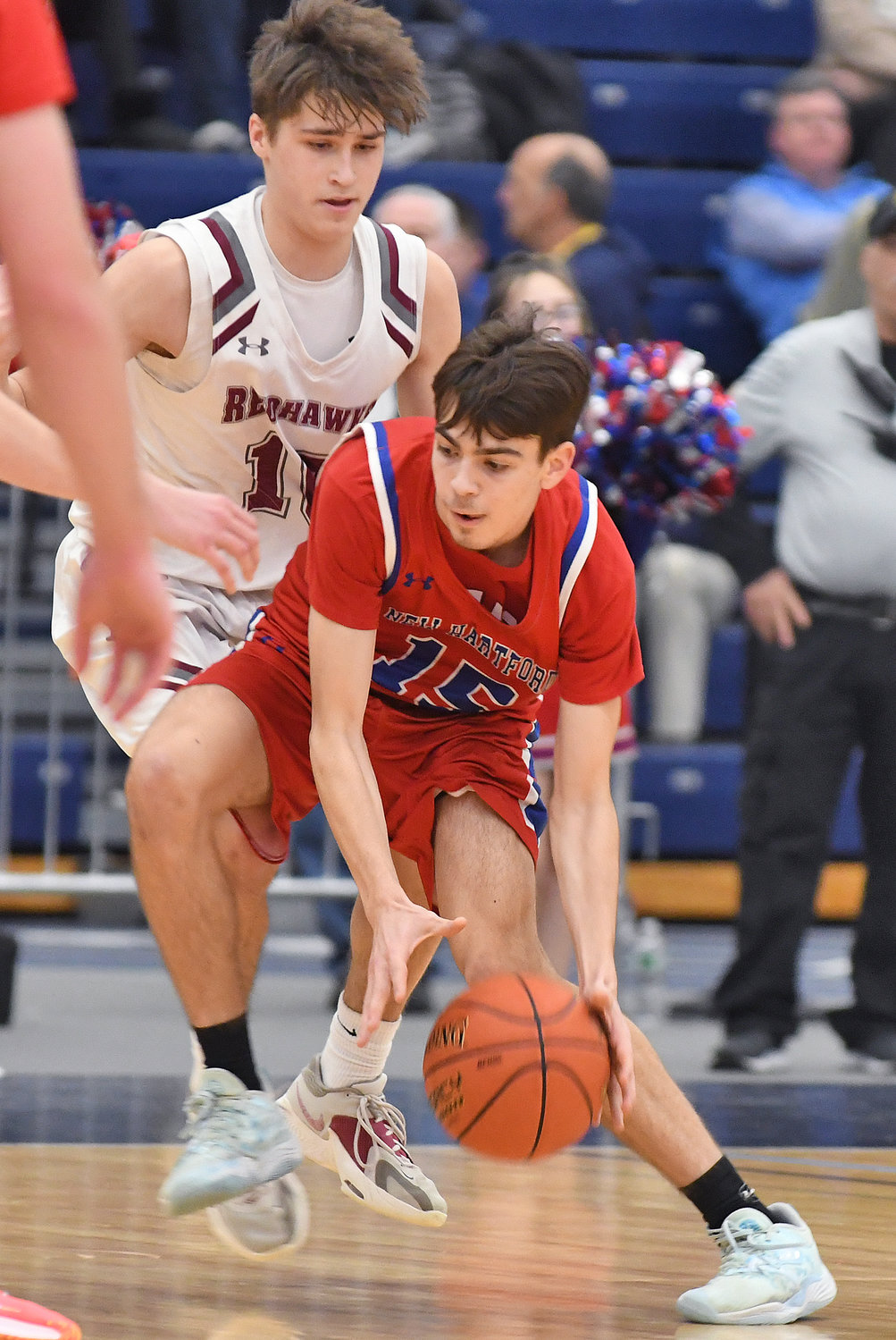 New Hartford's Jameson Stockwell tries to make a move against Central Square's Shane Bergquist in the second half Sunday night at SRC Arena. Stockwell had 15 points.