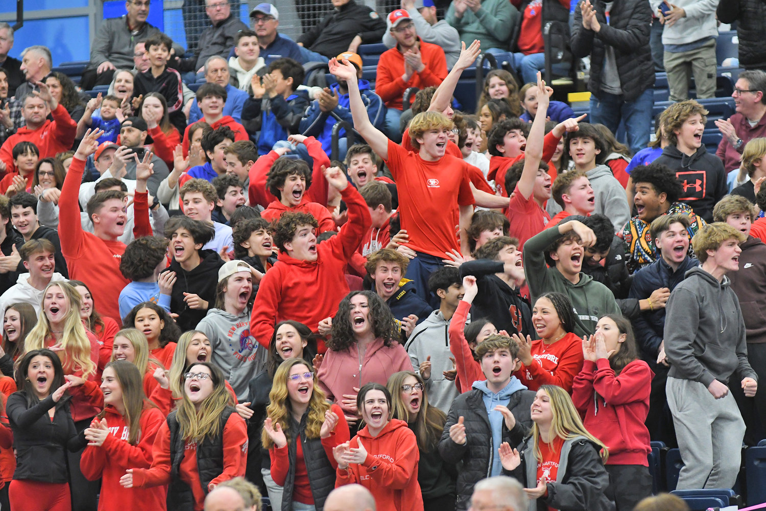 New Hartford student section celebrate a basket close to the end of the Section III Class A final against Central Square on Sunday night at OCC in Syracuse.
