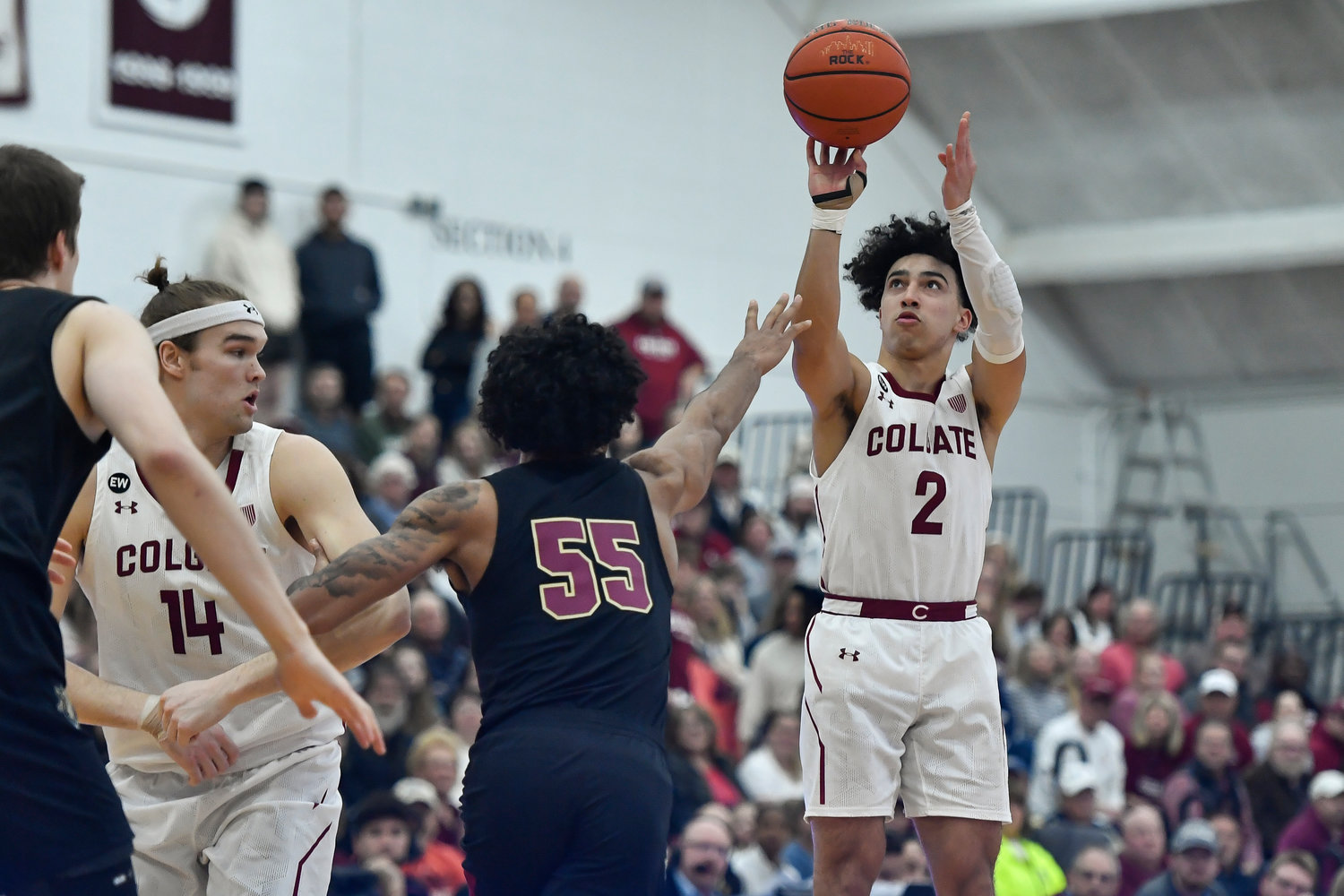 Colgate guard Braeden Smith (2) takes a shot over Lafayette forward Josh Rivera (55) during the first half of the Patriot League Tournament championship on Wednesday night in Hamilton.