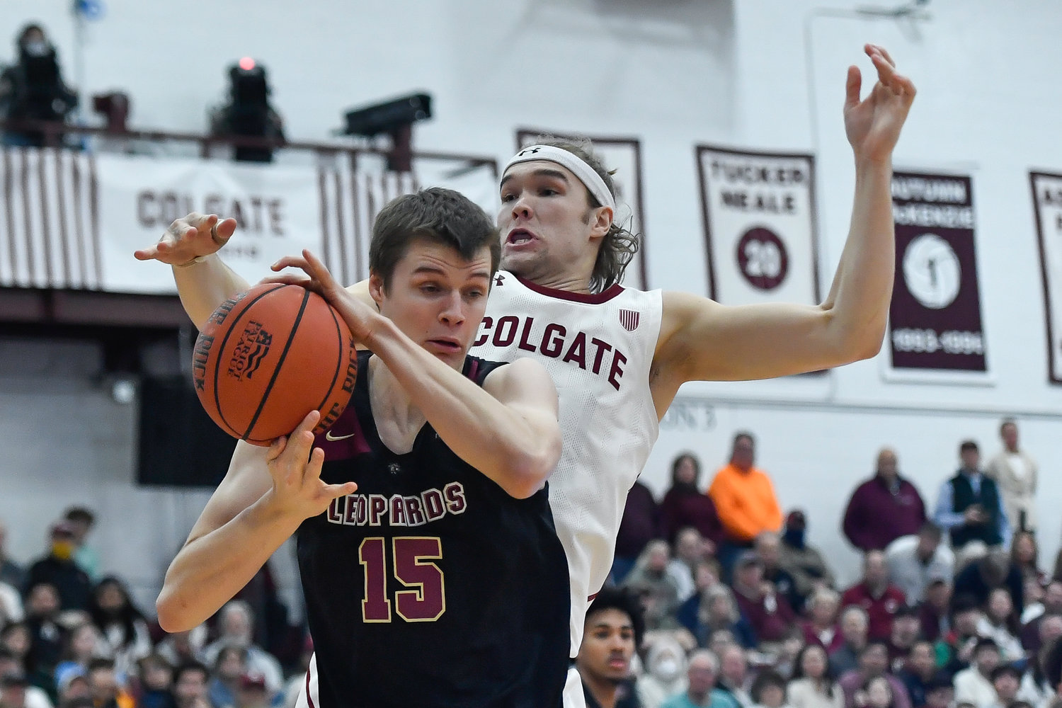 Lafayette center Justin Vander Baan, left, grabs a rebound in front of Colgate forward Keegan Records during the first half of the Patriot League Tournament championship on Wednesday night in Hamilton. Colgate won 79-61.