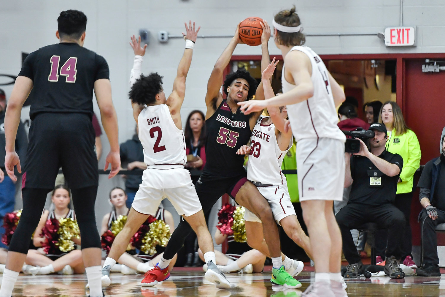 Lafayette forward Josh Rivera (55) is defended by Colgate guards Braeden Smith (2) and Oliver Lynch-Daniels (33) during the first half of the Patriot League Tournament championship on Wednesday night in Hamilton.