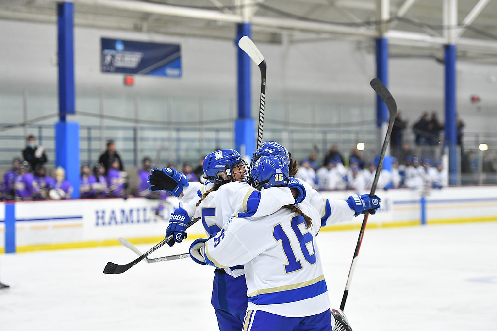 Sami Quackenbush (5) celebrates with teammates, including Maura Holden (16) after her first period goal that put the Hamilton College women's hockey team up 1-0 in an opening round playoff game against visiting Nazareth Thursday night. The Continentals won 3-1 to advance to the quarterfinals Saturday.