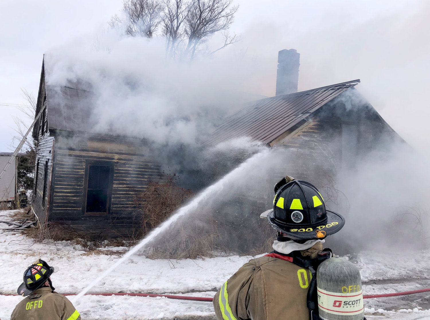 Firefighters from Oriskany Falls douse a blaze at an abandoned home on Route 20 in the Town of Madison Tuesday afternoon.