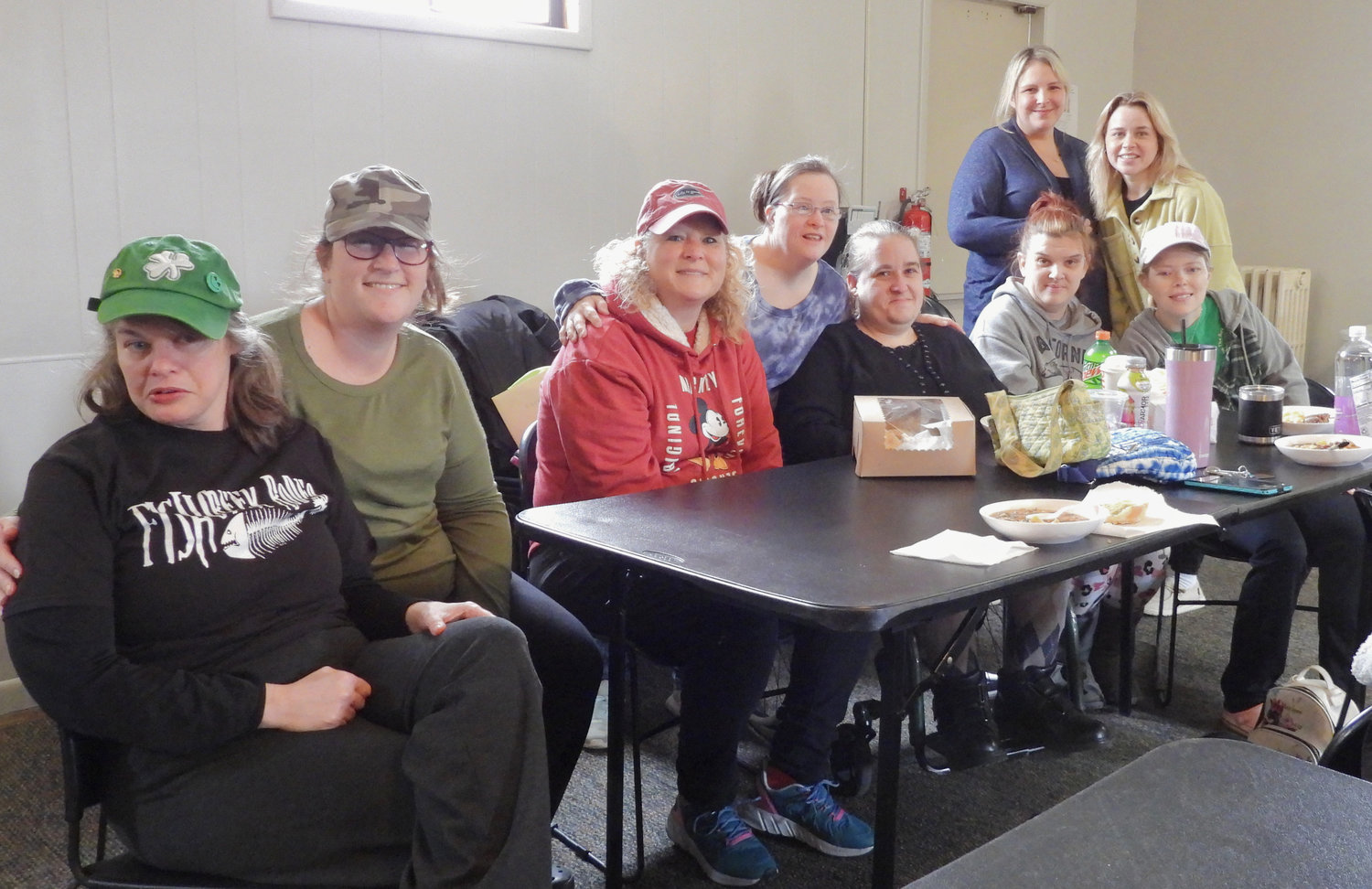 Volunteers at Church on the Rock pause for a brief moment for lunch and a photo. Pictured: Erin Conley, left, Katelyn Gardner, Faith Musachio, Aeryn Mitchell (Standing), Vicky Vanlale, Billie Jo Young, Brittany Agan, Carrie and Desirra Stedman (Standing)