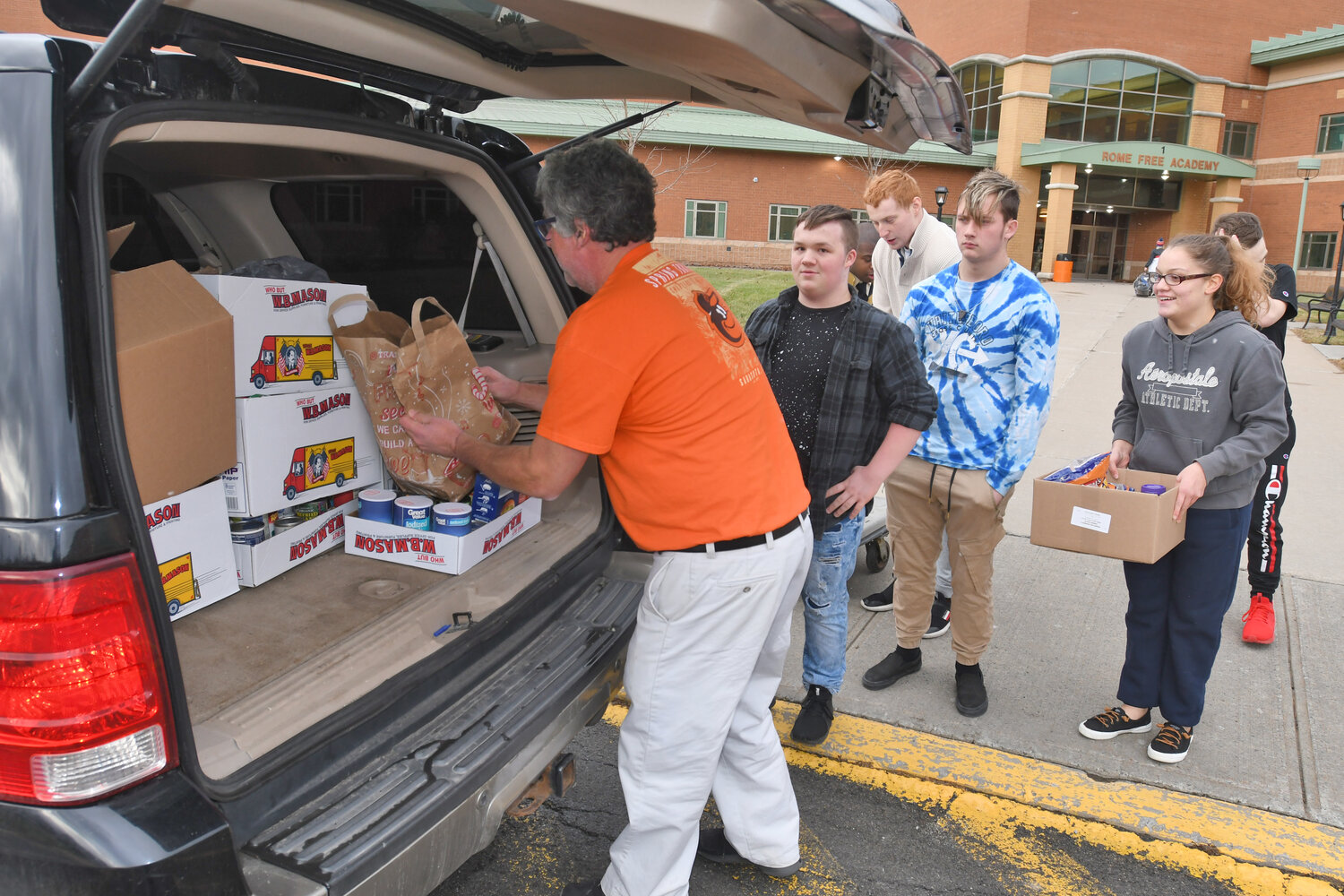 The Utica Food Pantry relies on monetary donations and food drives in order to address local food insecurity. Above, in 2022, Rome Free Academy teacher Rob Wood loads boxes of canned goods that RFA students and the RFA Student Association donated to the Gansevoort and Bellamy Elementary School food pantrys.