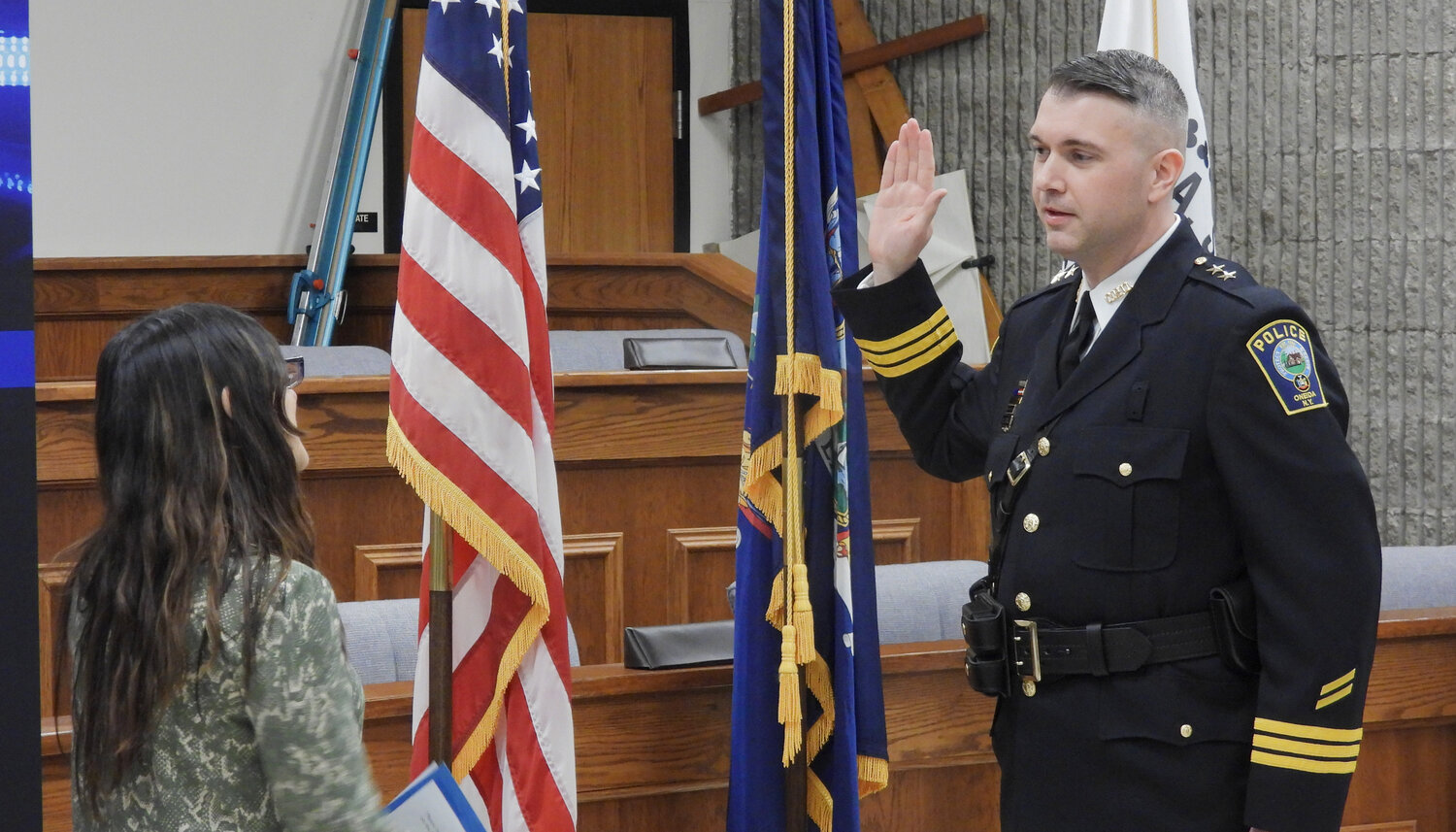Oneida Police Chief Steven Lowell takes his oath of office at a swearing-in ceremony in the Oneida Common Council on Thursday, March 9