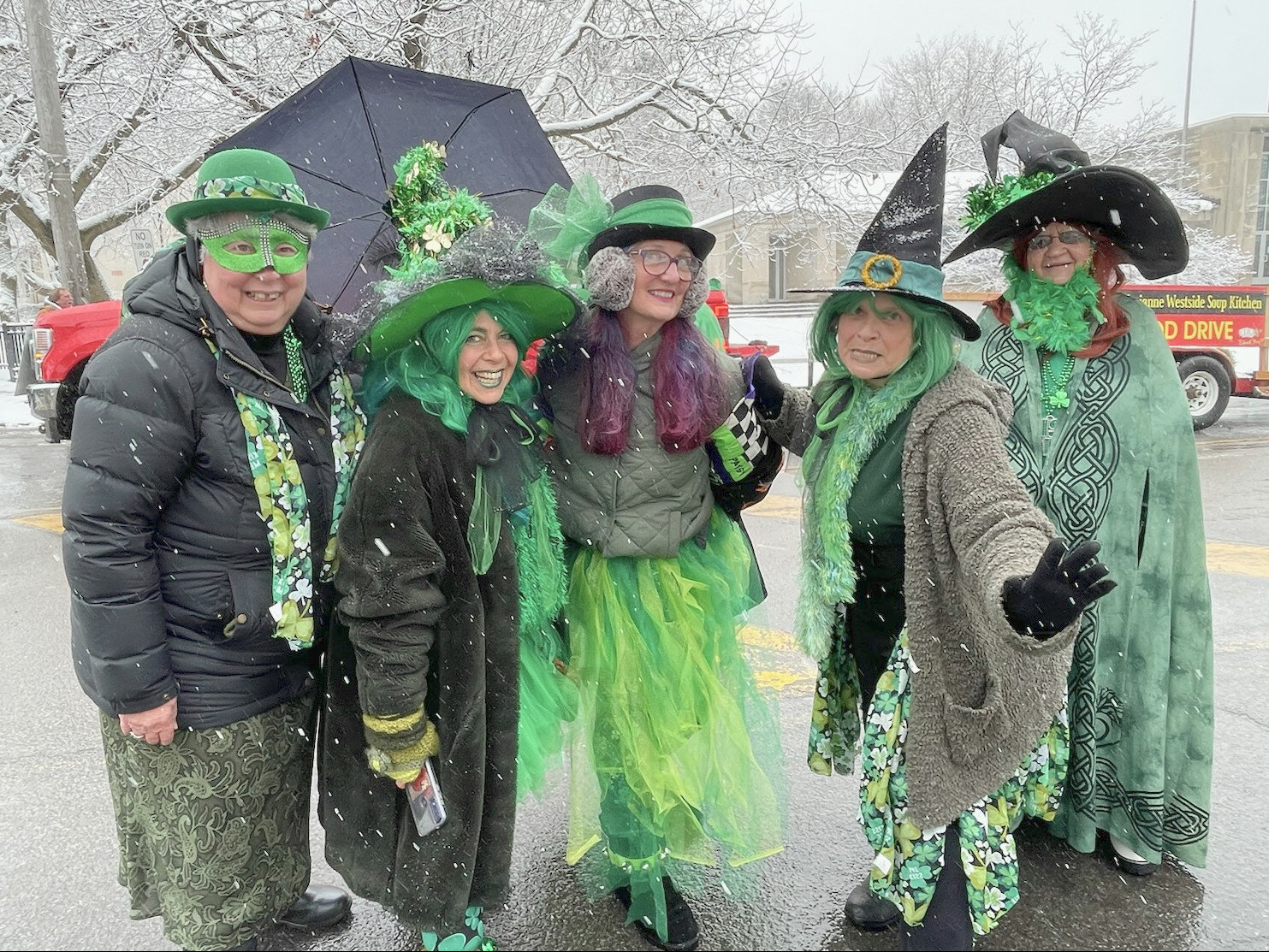 These witchy women, part of the Happy Hags Dance Troupe, don their leprechaun green as they get ready to dance down Genesee Street for Utica's St. Patrick's Day Parade on Saturday, March 11.