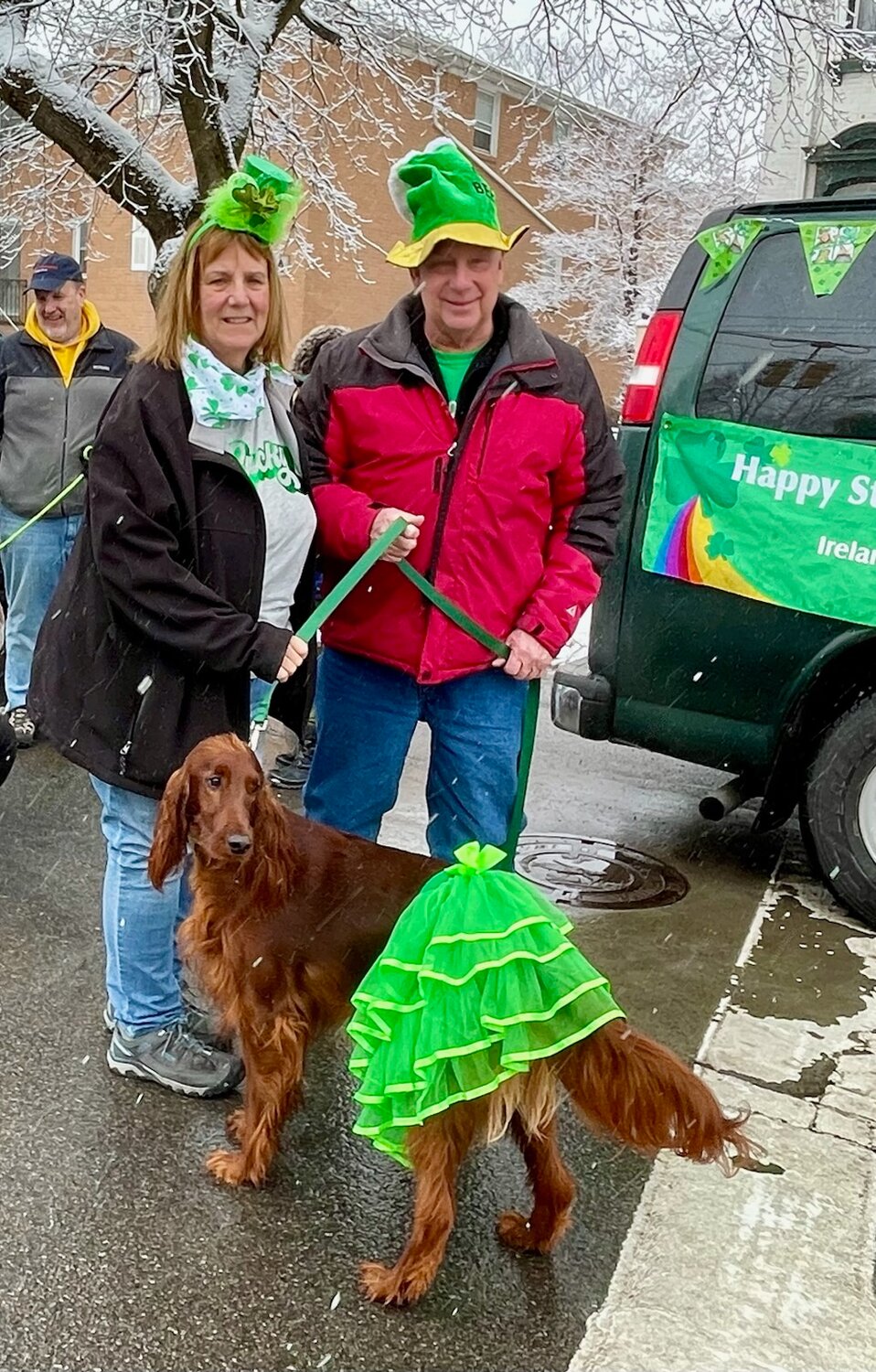 Rick and Chris Busey, with their Irish Setter Bailey, came all the way from Ticonderoga to take part in their first Utica St. Patricks Day Parade.