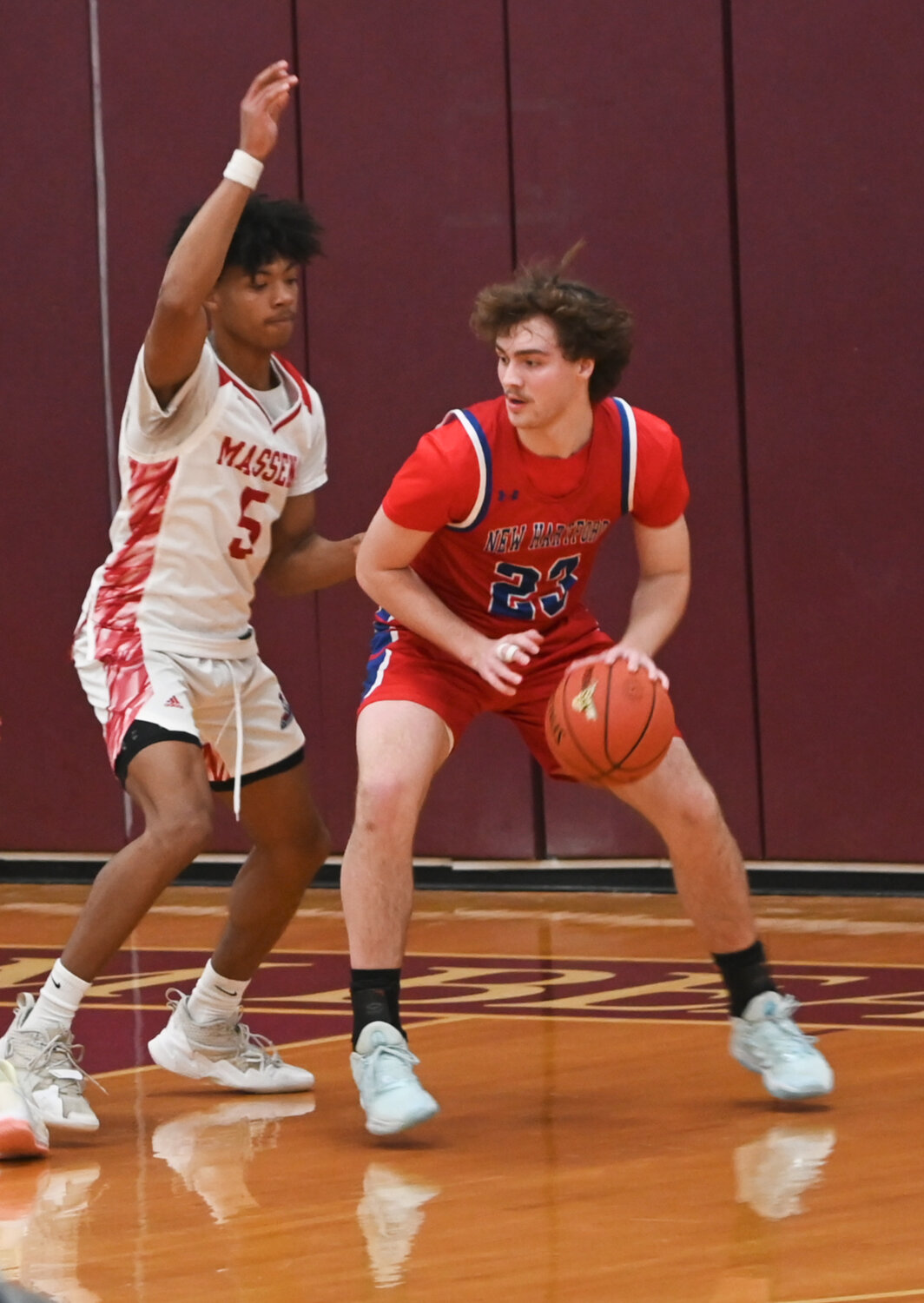 New Hartford's Zack Philipkoski looks for space near the basket on Saturday in the Class A regional final against Massena on Saturday at SUNY Potsdam. New Hartford led by 30 at halftime and rolled to a 68-35 win.