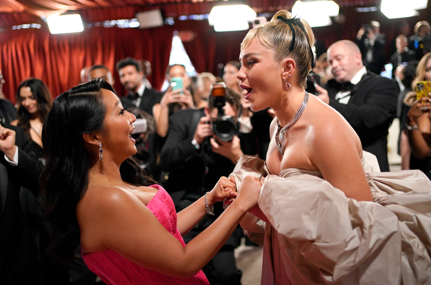 Stephanie Hsu, left, and Florence Pugh arrive at the Oscars on Sunday, March 12, 2023, at the Dolby Theatre in Los Angeles. (AP Photo/John Locher)