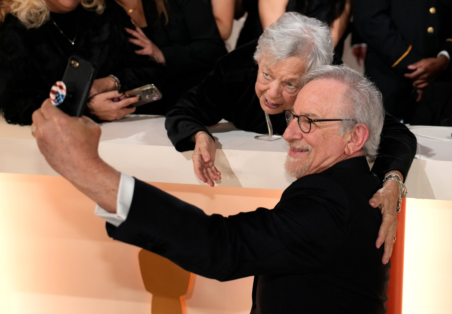 Steven Spielberg poses for a selfie with fan on carpet at the Oscars on Sunday, March 12, 2023, at the Dolby Theatre in Los Angeles. (AP Photo/John Locher)