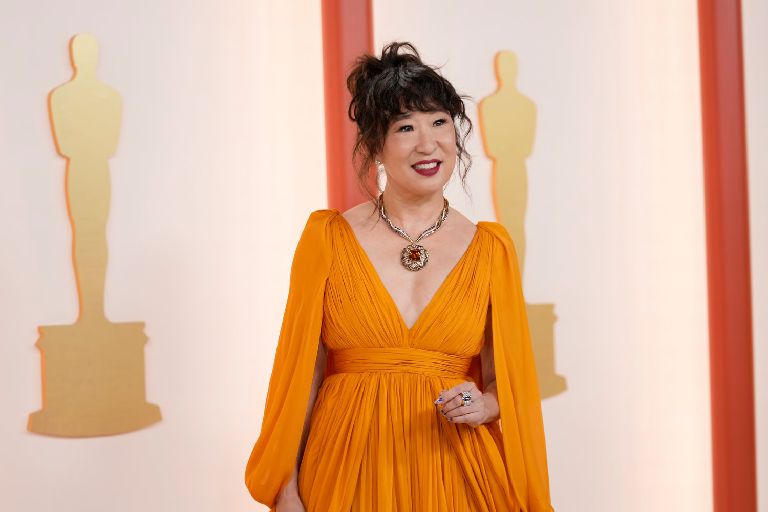 Sandra Oh arrives at the Oscars on Sunday, March 12, 2023, at the Dolby Theatre in Los Angeles. (AP Photo/Ashley Landis)