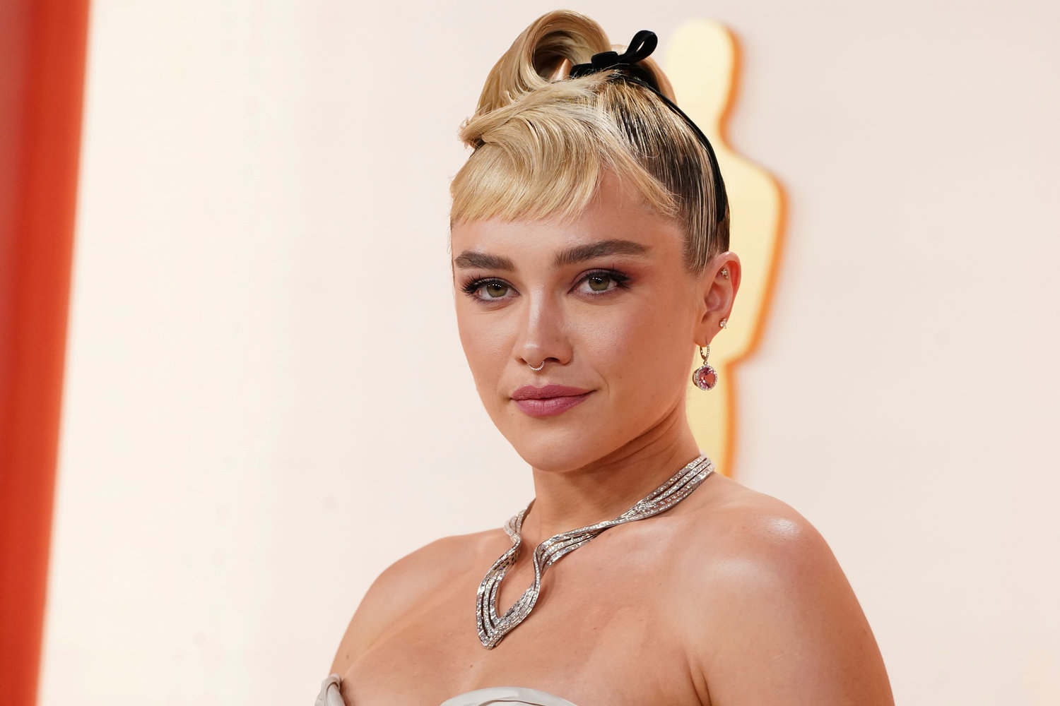 Florence Pugh arrives at the Oscars on Sunday, March 12, 2023, at the Dolby Theatre in Los Angeles. (Photo by Jordan Strauss/Invision/AP)