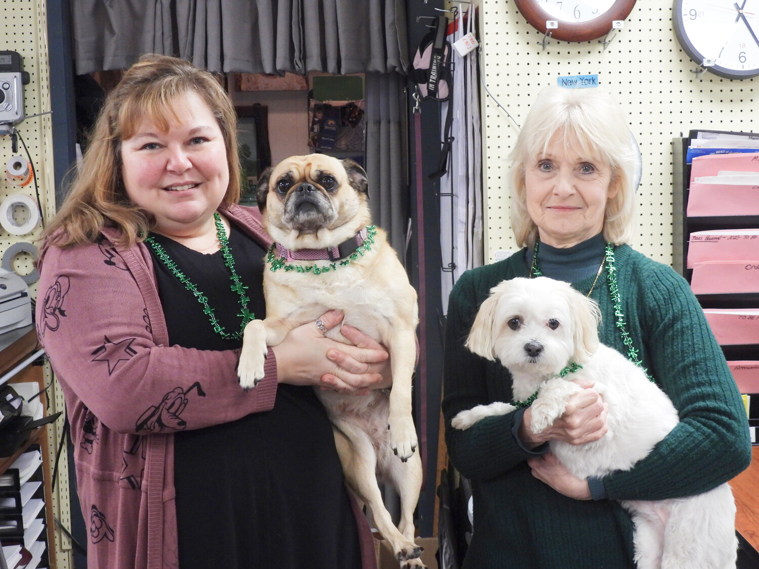 Oneida Office Supply Owner Nancy Kinney, right, and Manager Stacy Jones are happy to help anyone who comes through their door. Their dogs, Poppy and Daisy, are a common sight at the store and fond of guests