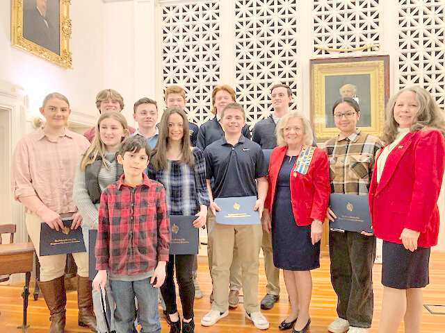 AWARD RECIPIENTS — The Oneida Chapter of the National Society of the Daughters of the American Revolution recently recognized the winners of its student awards with a ceremony at the Oneida County History Center, 1608 Genesee St. in Utica. Students from Notre Dame, Central Valley, Proctor, Sauquoit Valley, Frankfort-Schuyler, Clinton, New Hartford, as well as local homeschool students, received awards totaling more than $2,000. Front: Cohen Brocket; first row, from left: Ruth Dibble, Gianna Acey, Ella McCarthy, Jack McMurray, Oneida Chapter Regent Trena DeFranco, Nellcy Blu, and Mischael McKenna; back row: James Klein, Austin Tubia, Paul Kearny, Jake Englehart, and Trey Murnane.
