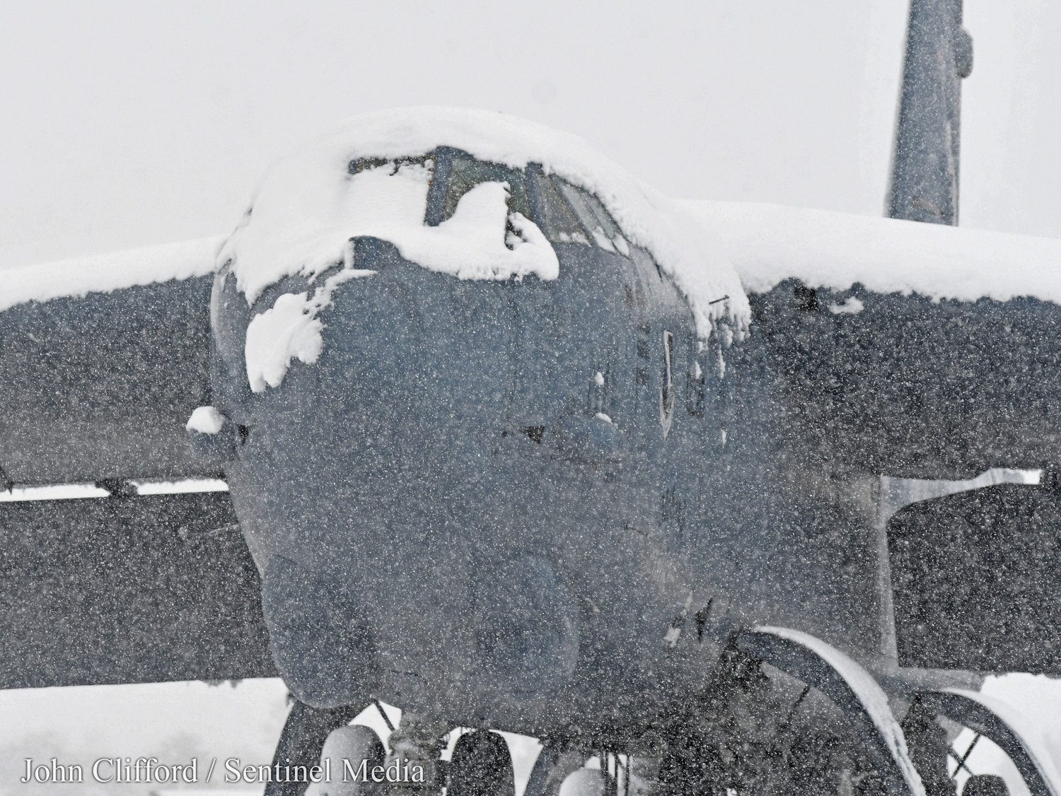 The snow covered static B-52 covered in snow Tuesday, March 14, 2023.