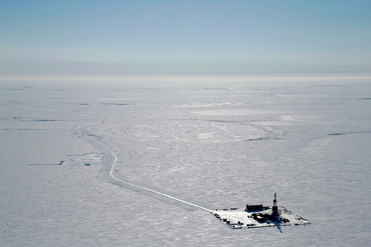 This 2019 aerial photo provided by ConocoPhillips shows an exploratory drilling camp at the proposed site of the Willow oil project on Alaska’s North Slope. The Biden administration’s approval of the massive oil development in northern Alaska on Monday, March 13, commits the U.S. to yet another decadeslong crude project even as scientists urgently warn that only a halt to more fossil fuel emissions can stem climate change.