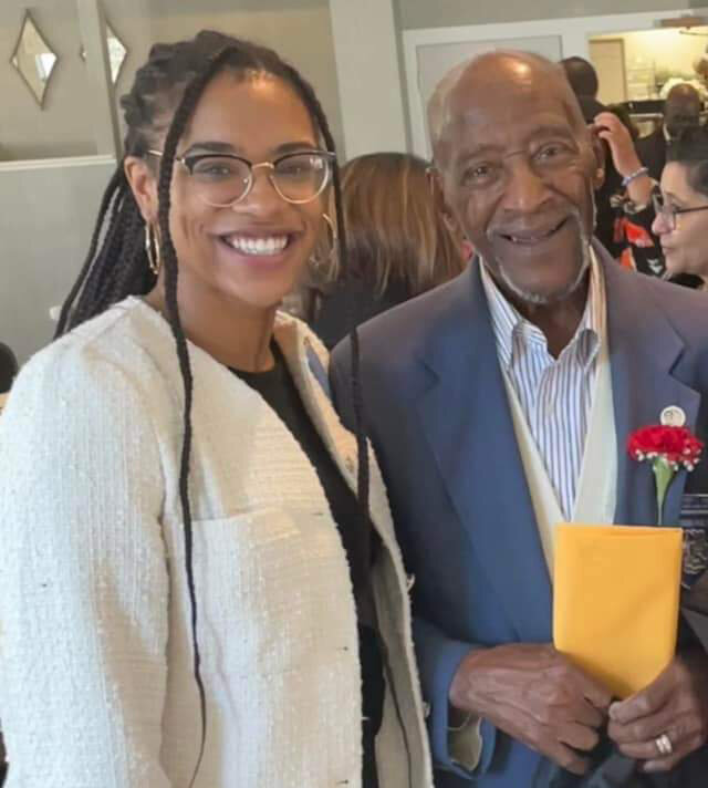 Hilda M. Jordan, left, a Harvard University graduate and president of the Mohawk Valley Junior Frontiers Alumni Impact Collective, honors local resident Herbert Thorpe, a member of the famed  Tuskegee Airman of World War II, during a recent Black history mixer.