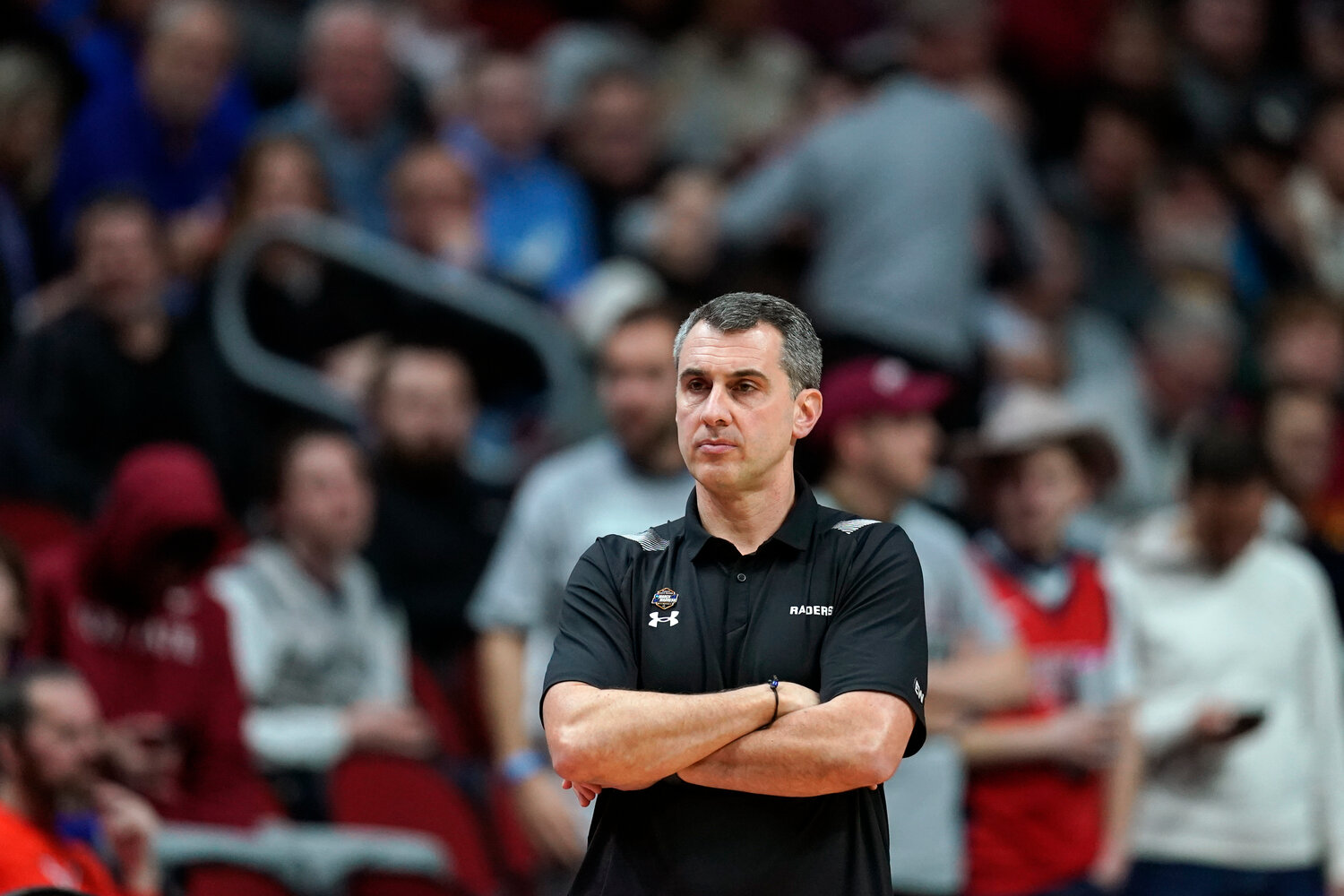 Colgate head coach Matt Langel watches from the bench in the first half of a first-round NCAA Tournament game against Texas on Thursday night in Des Moines, Iowa.