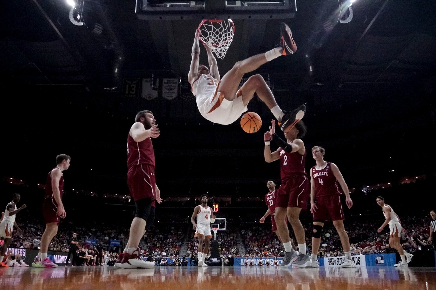 Texas' Christian Bishop dunks during second half of a first-round NCAA Tournament game against Colgate on Thursday night in Des Moines, Iowa.