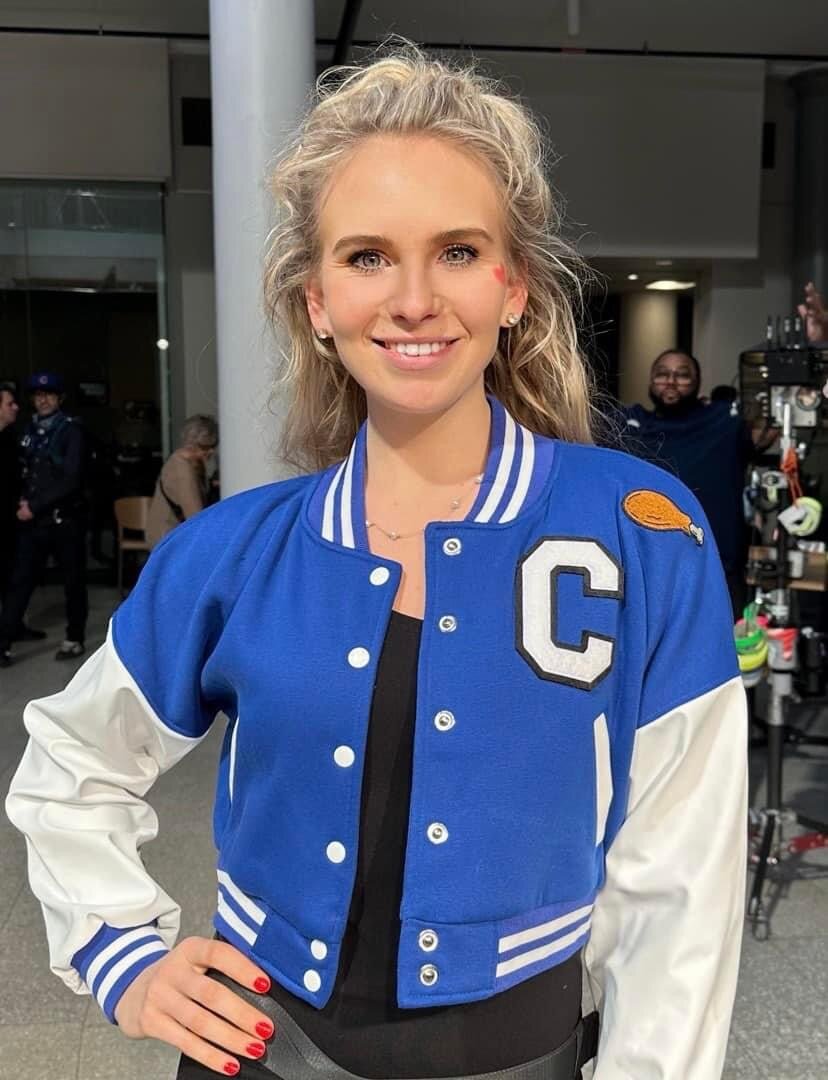 Emilya Washeleski, of Taberg, with the sports jacket made for her during the recent filming of a Wegmans commercial that aired during the Super Bowl and the Oscars. Washeleski said she believes the jacket was a sign to continue being authentic and true to her Taberg/Camden roots.