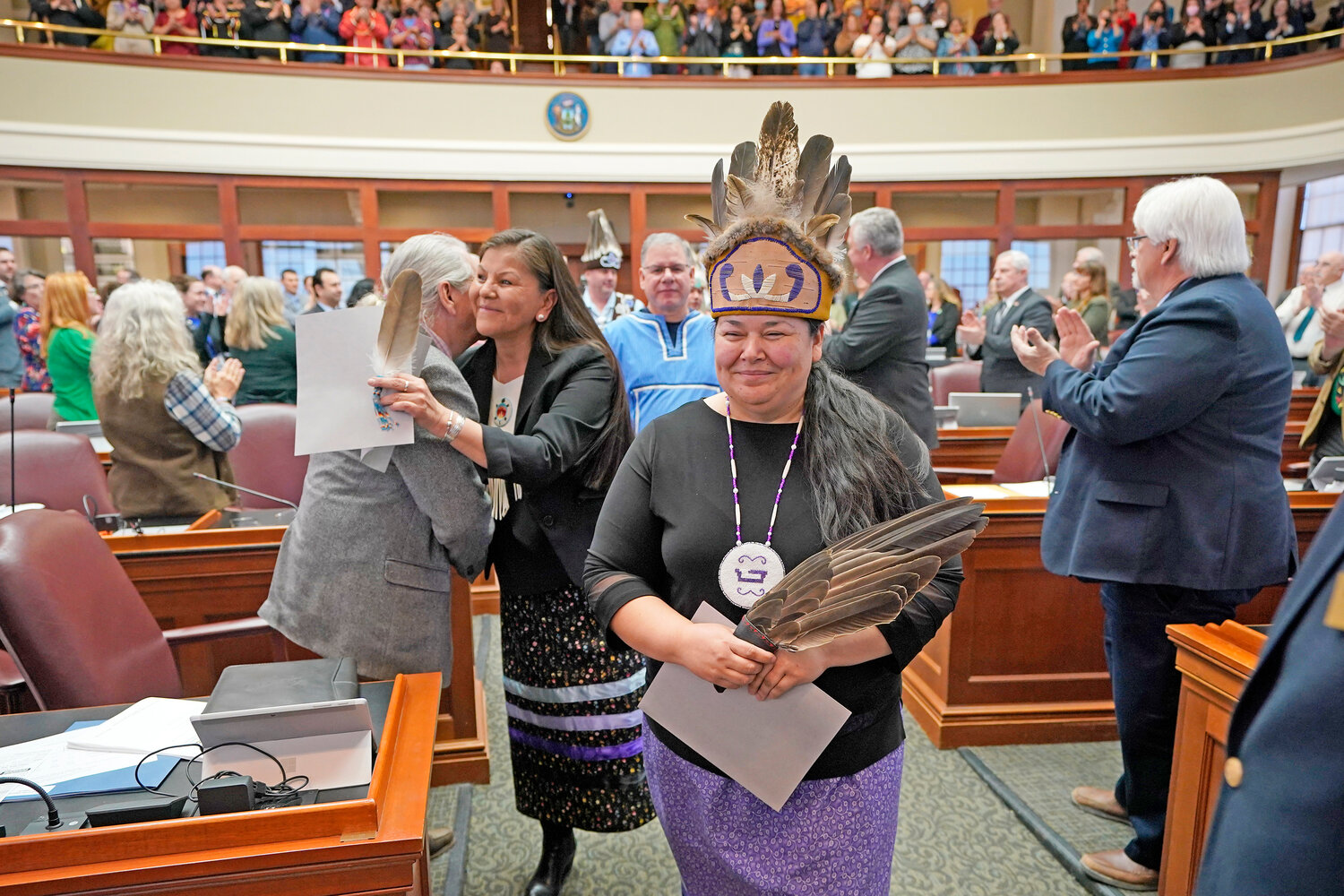 Clarissa Sabattis, Chief of the Houlton Band of Maliseets, foreground, and other leaders of Maine’s tribes are welcomed by lawmakers into the House Chamber, Wednesday, March 16, at the State House in Augusta, Maine.