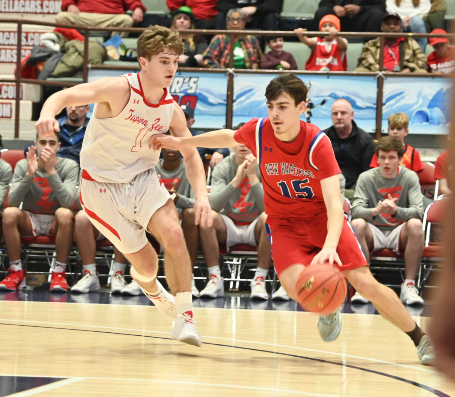 New Hartford's Jameson Stockwell tries to drive against Tappen Zee's Sean Berrigan on Friday in the state Class A semifinal Friday at Cool Insuring Arena on Glens Falls. New Hartford, playing in the final four for the second time in as many seasons, lost 58-48.
