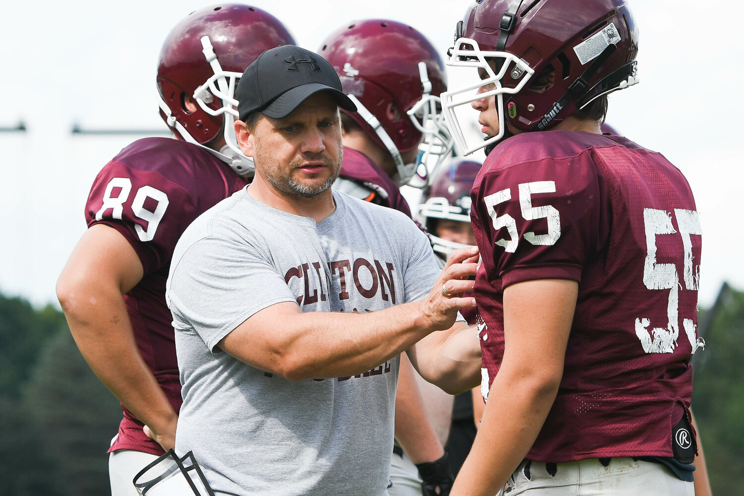 Clinton head coach Jason Alexander helps coordinate special teams drills during a practice last season. Clinton is moving from Class C to eight-man football this fall.