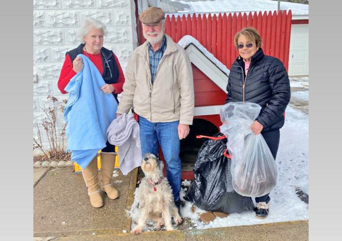 From left, Sara Tuthill of the Humane Society of Rome, and Rotarians Glen Bahr, Carla Till and Halia (Bahr’s constant K-9 companion).