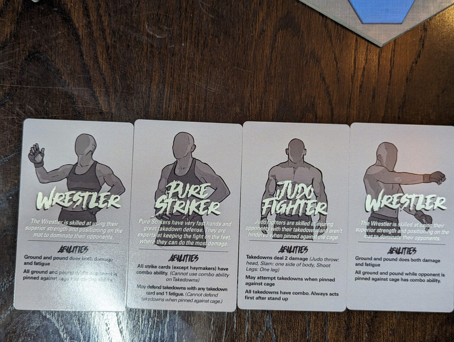 Caged In is bringing mixed martial arts to the world of board games and grows into crowfunding on GameFound.com on Wednesday, March 29. Pictured are some of the cards used in the game.