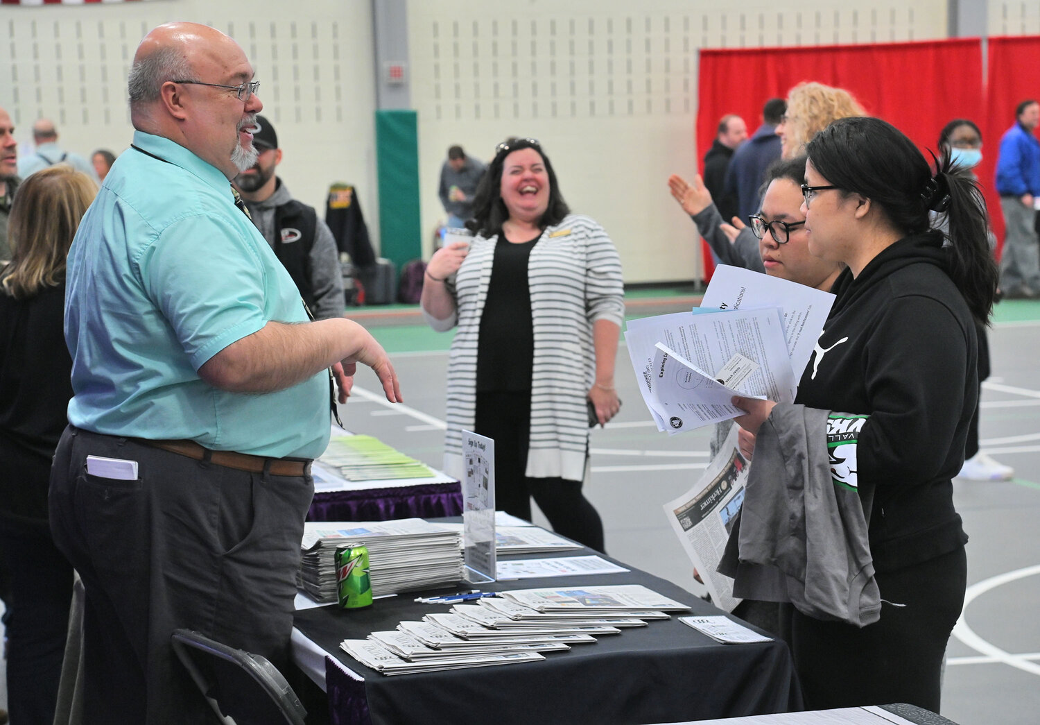 The Sentinel Media Company's own Mike Jaquays, left, in action Tuesday, March 21 during the Exploring Careers in the Mohawk Valley job fair event at Mohawk Valley Community College in Utica.