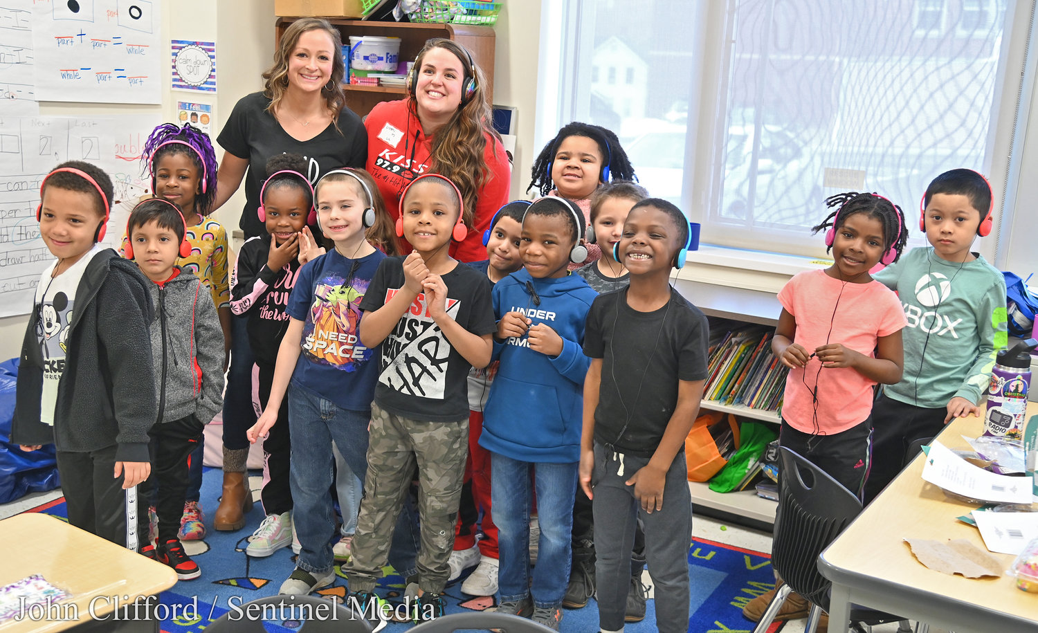Teacher Jordyn Dunlap and her class with Liz Ellis from Kiss FM  after the personality read a book to her class Friday morning at Kernan Elementary School.