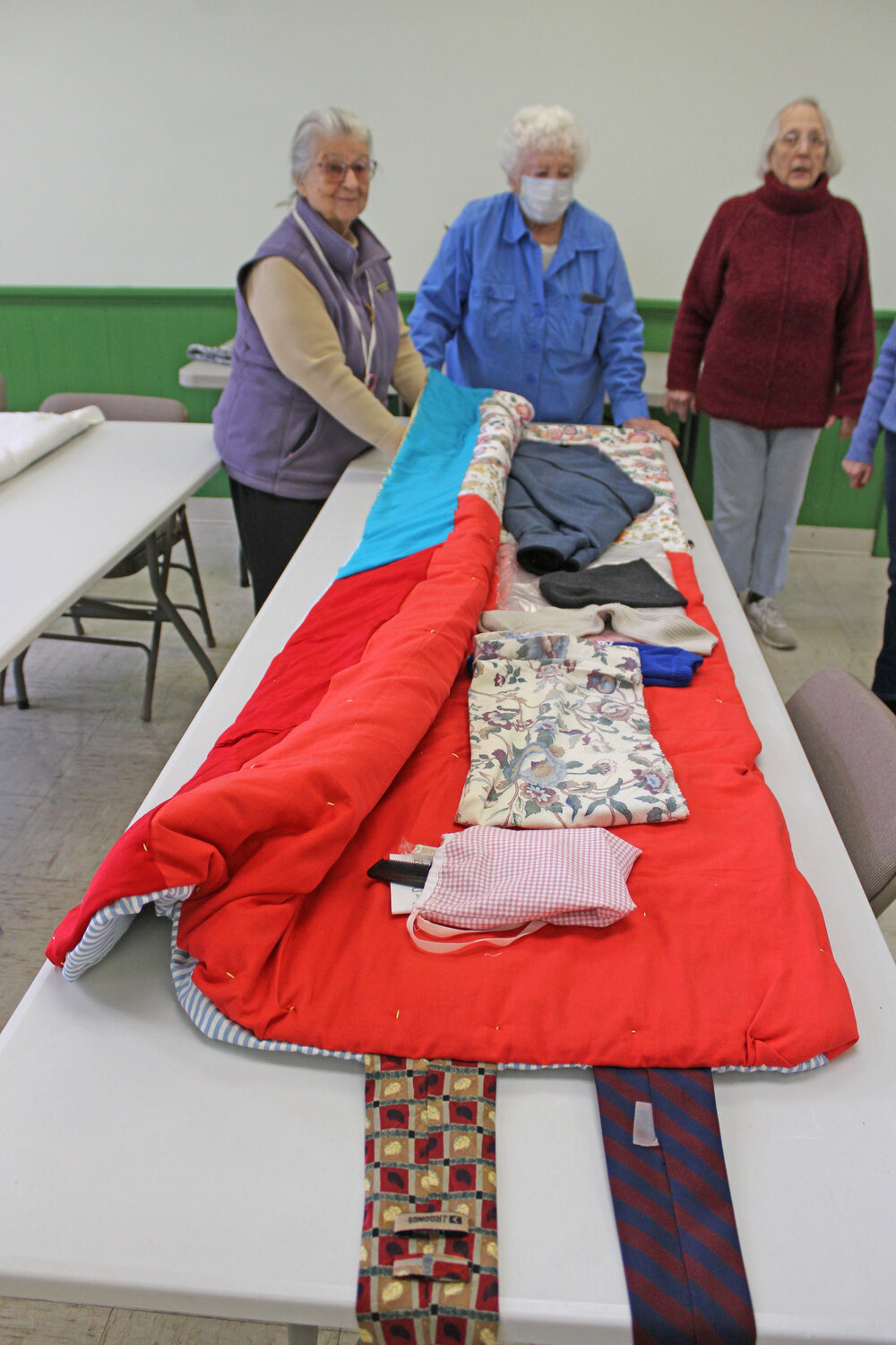 Sleeping bags are distributed with hygiene products, hats, gloves, socks, scarves and pillow covers — whatever has been donated.