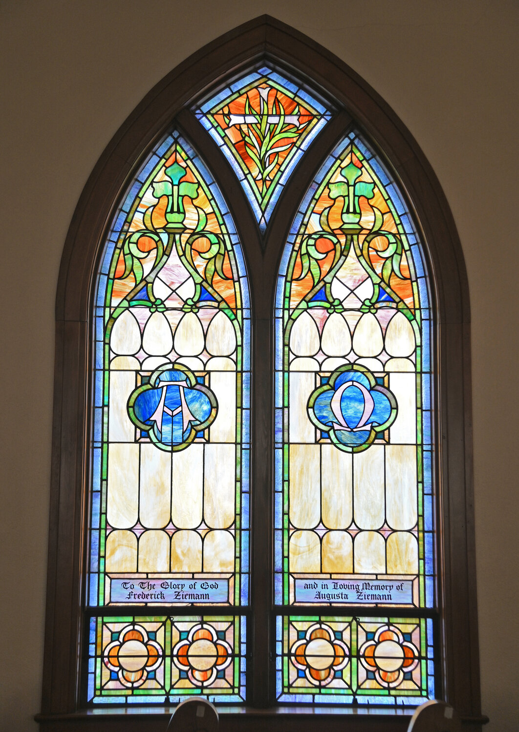This stained glass window, displaying the symbols of Alpha — the beginning, and Omega — the end, is one of the historic windows inside Trinity Church at 215 W. Court St., Rome.