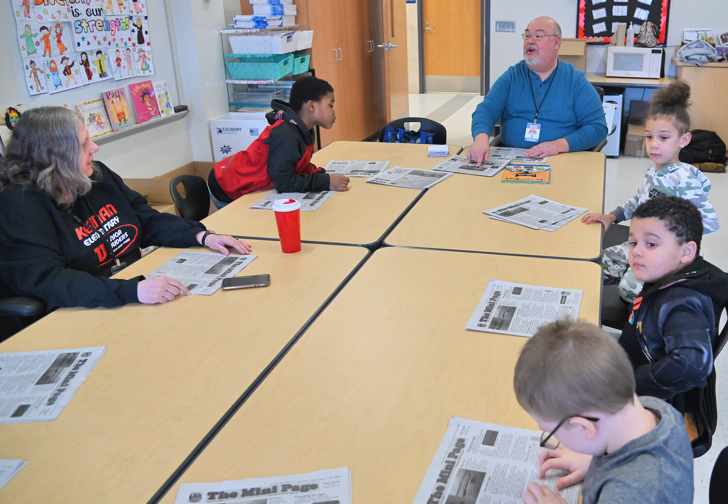 Sentinel Media Company reporter Mike Jaquays talks about the paper's "The Mini Page" for younger readers Friday, March 24 during the Community Reader's Day event at Kernan Elementary School in Utica.