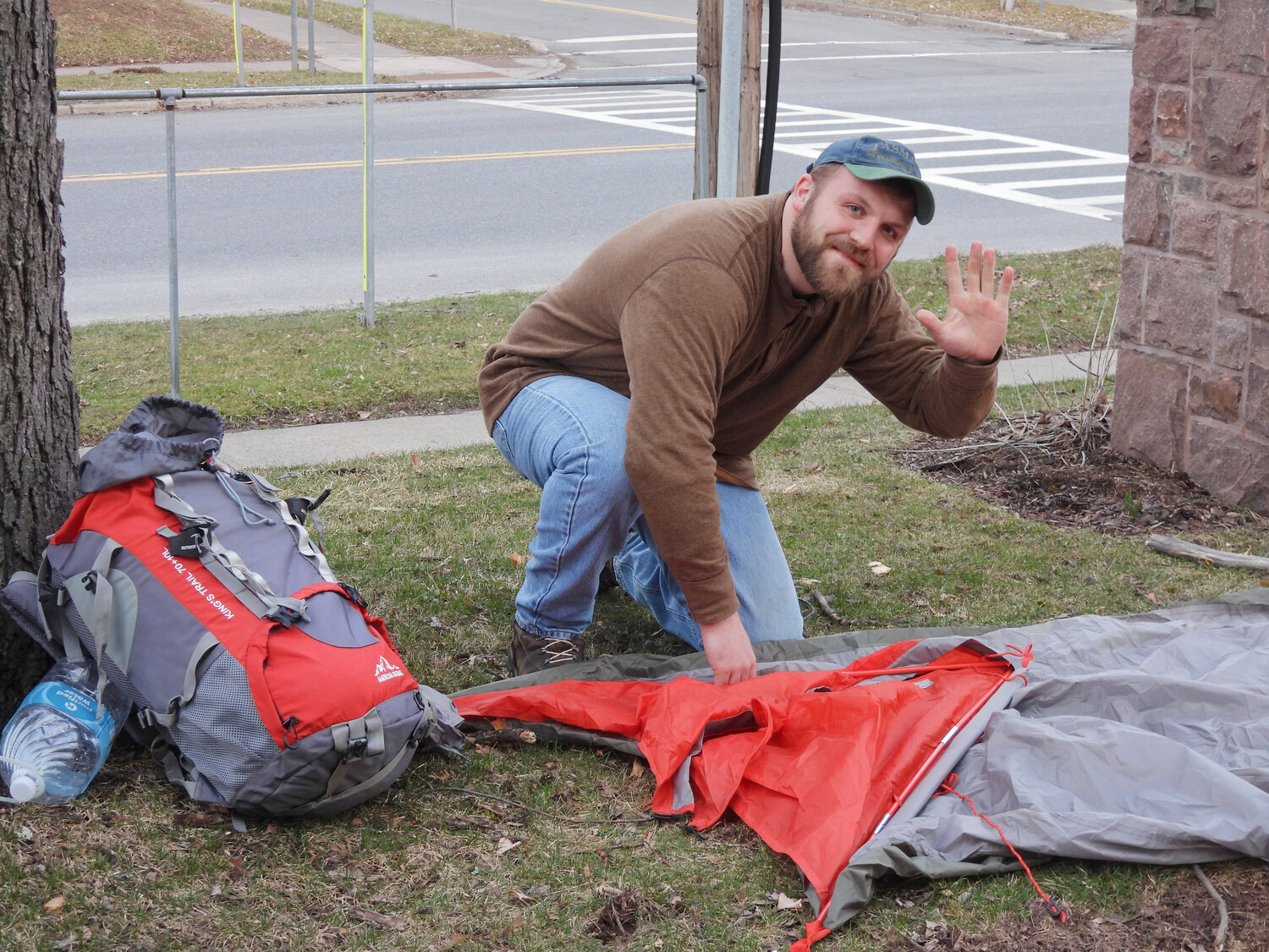 Keegan Richie works to set up his tent for the homelessness awareness sleep-out.