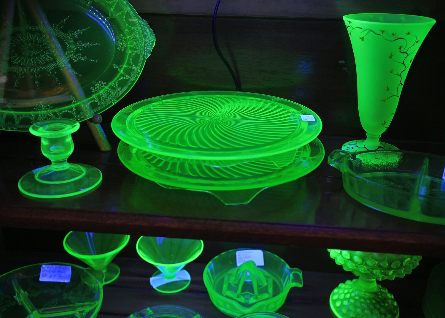 A display of uranium glass glows Friday, March 10 at Victoria Rose in Bouckville.