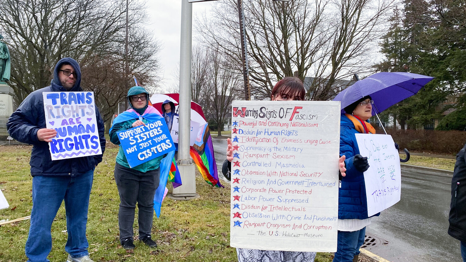 Participants in the International Transgender Day of Visibility rally display signs of support for the rights of transgender people on Friday, March 31.