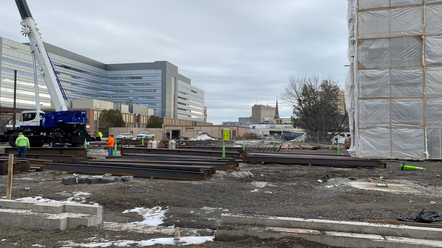 The property at 411 Columbia St., JP O’Brien Plumbing &amp; Heating, surrounded by construction of the Wynn Hospital and the parking garage in downtown Utica back in December 2022.