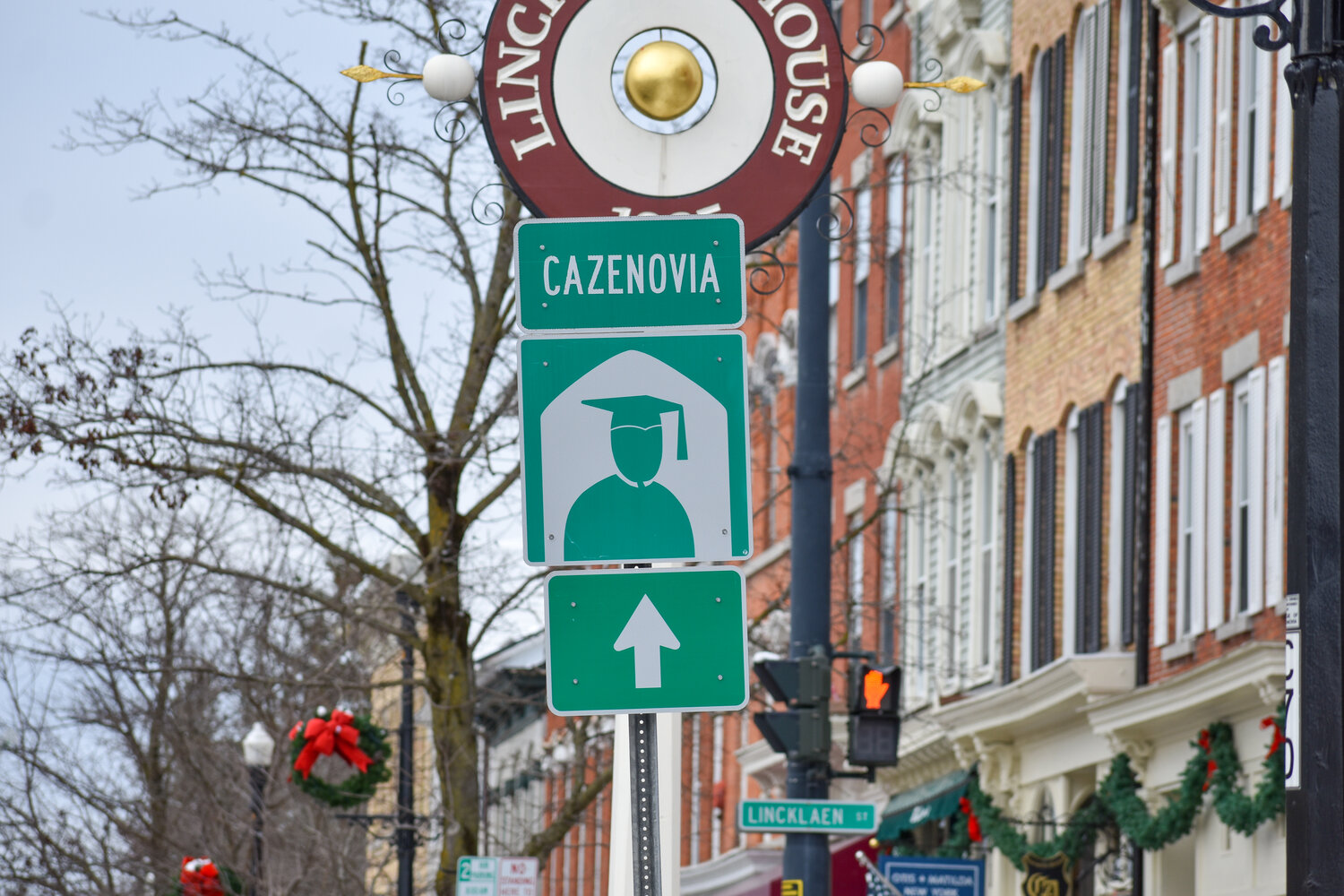 A sign on Albany Street in Cazenovia directs travelers to Cazenovia College. The college is set to close after the spring 2023 semester.