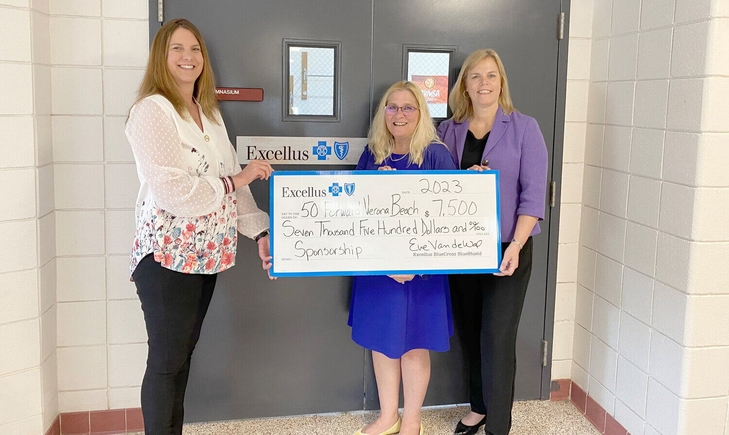 Officials from 50 Forward Mohawk Valley and Excellus BlueCross BlueShield pose with a ceremonial check for $7,500, representing a grant from Excellus to support 50 Forward MV’s efforts to build health and wellness programs for older adults at its Verona Beach Center.