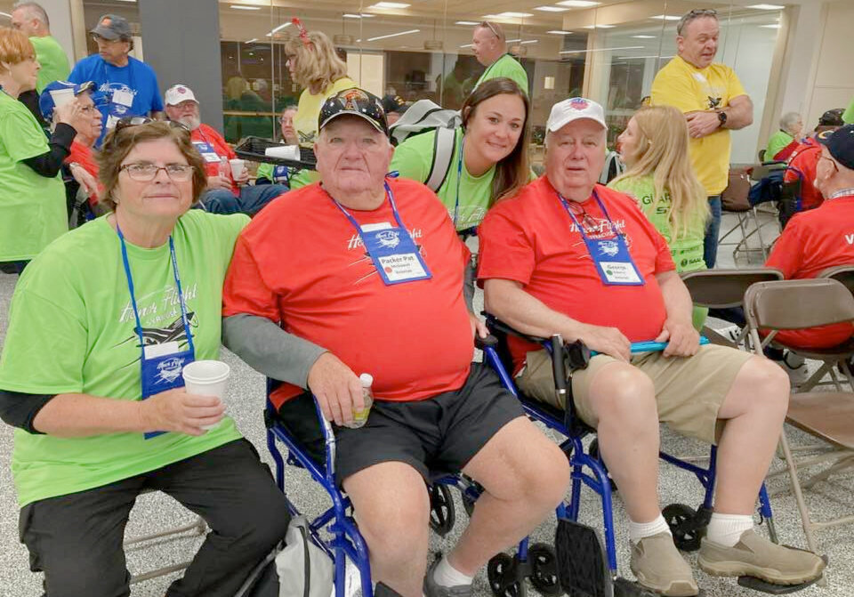 Honor Flight participants wait for their early morning flight to Washington, D.C. Pictured: Marilyn McGowan, left, Patrick McGowan, Kerry Vanvechen, and George Roberts.