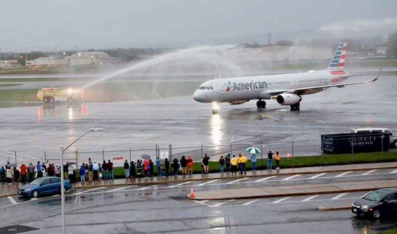 The plane lands carrying veterans for the Honor Flight program in Washington, D.C., receiving a water cannon salute.
