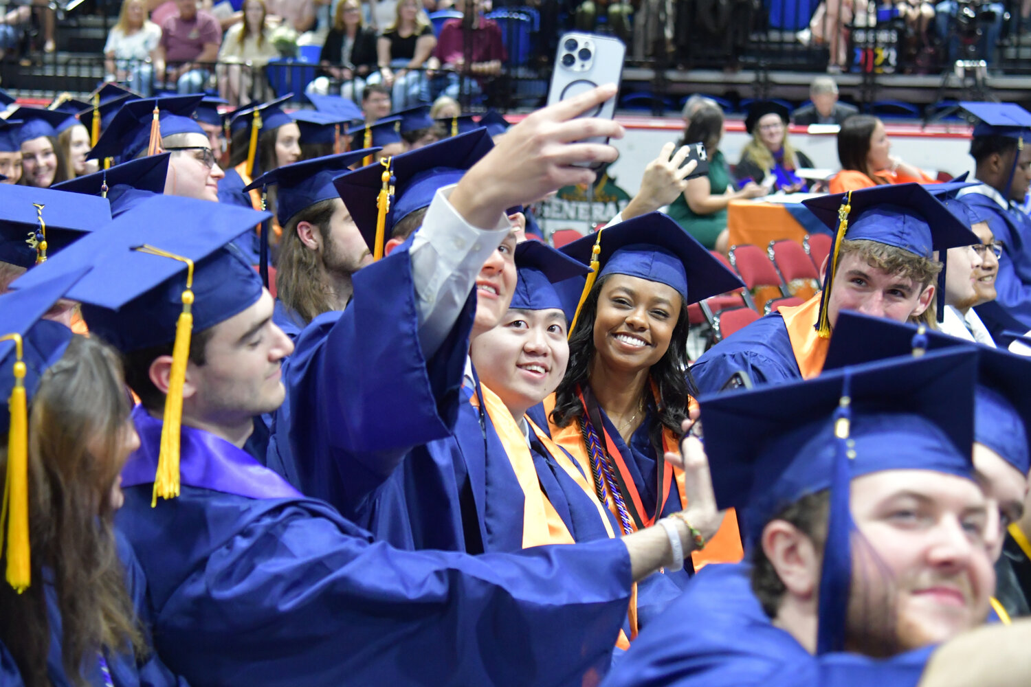 Students take the opportunity to capture selfies during Utica University's 74th undergraduate commencement ceremony.