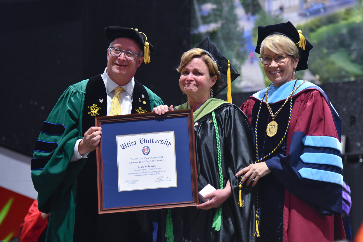 Mary Siniscarco, associate professor of health studies, was joined by Utica University President Laura Casamento and Provost Todd Pfannestiel, as she was awarded the 49th Dr. Virgil Crisafulli Distinguished Teaching Award, a recognition for outstanding teaching effectiveness.